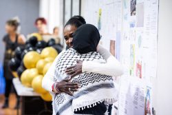 Sara Muzamil, JRS Australia Finding Safety Project Coordinator, shares a hug with a guest at our "Free Together" Refugee Leadership event on 19 July 2024.